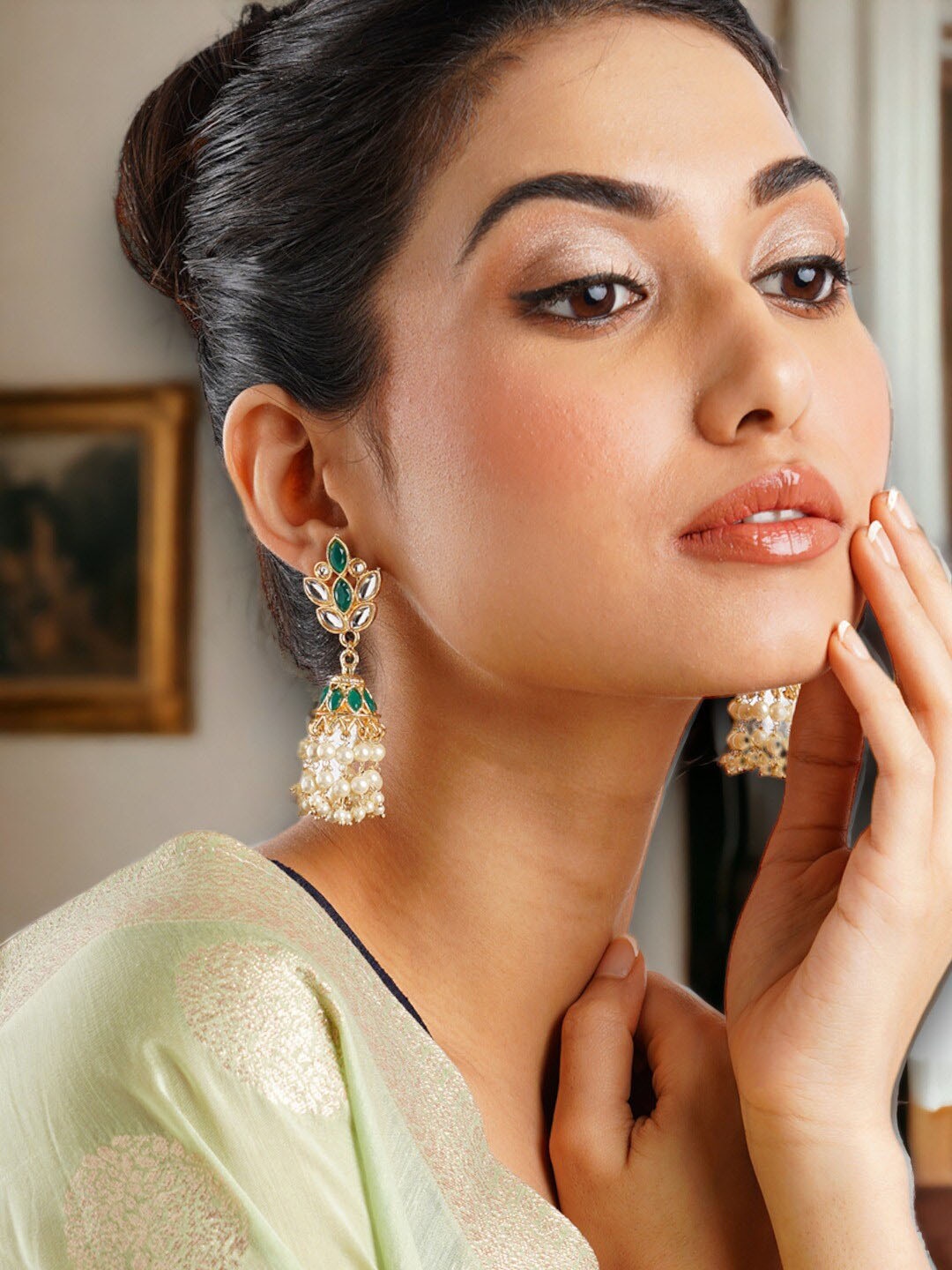 

Anouk Gold-Plated Green Dome Shaped Jhumkas Earrings