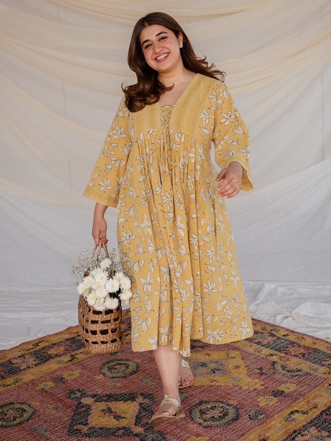 

THE INDIAN ETHNIC CO Floral Printed Tie Up Neck Cotton A-Line Midi Dress, Yellow