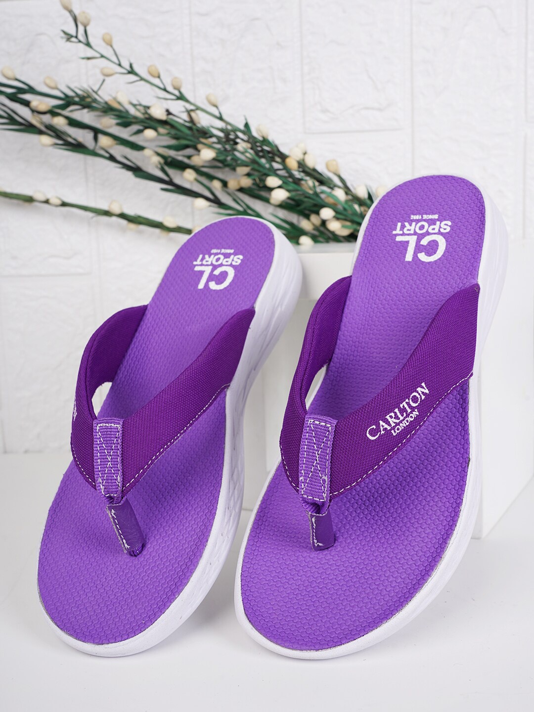

Carlton London sports Women Slip-On Flip Flops, Purple
