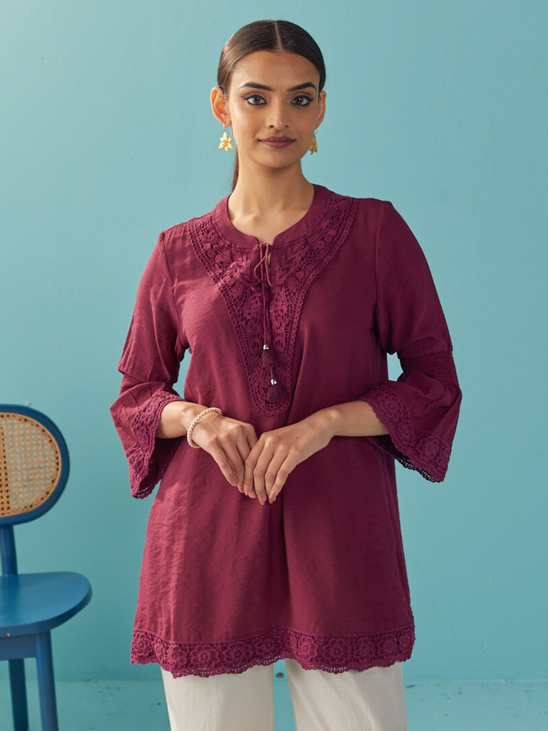 

Lakshita Burgundy Tie-Up Neck Bell Sleeves Lace Inserts Tunic