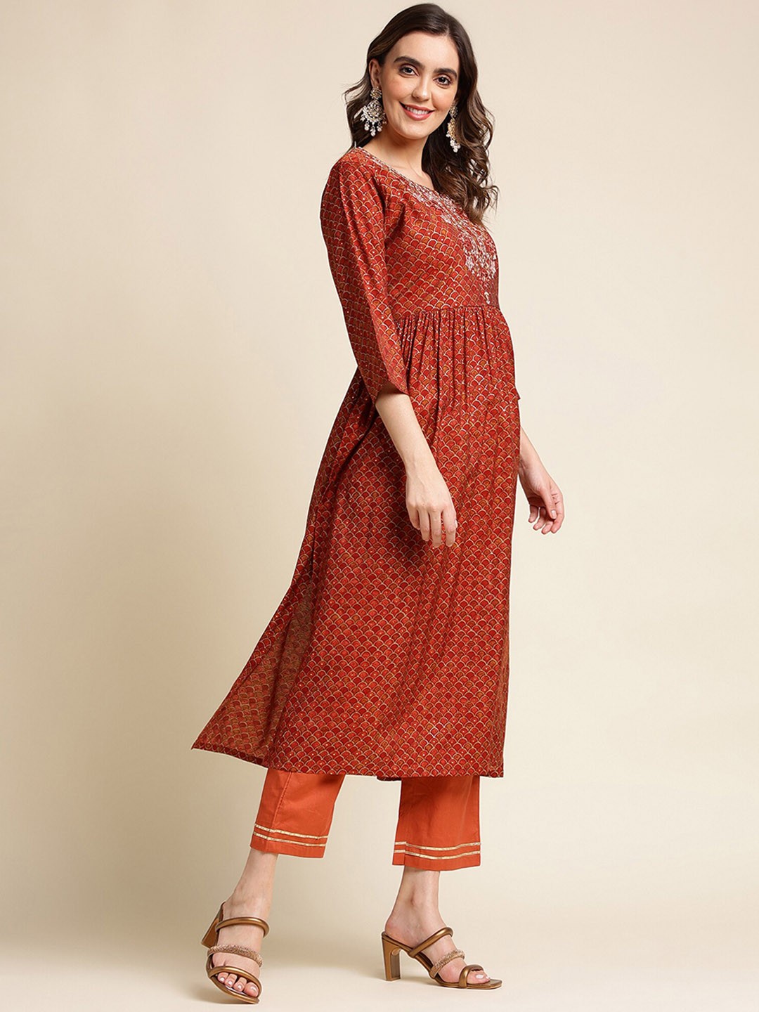 

Nimayaa Women Yoke Design Pleated Mirror Work Kurta with Trousers & With Dupatta, Rust