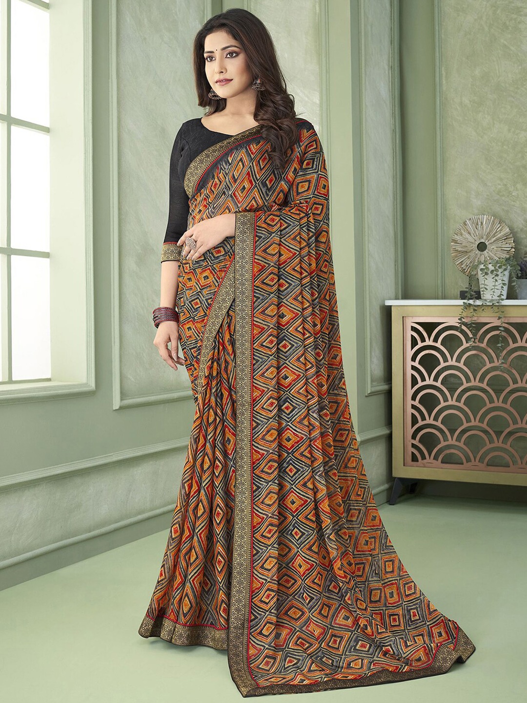 

Mitera Orange Geometric Printed Poly Chiffon Saree