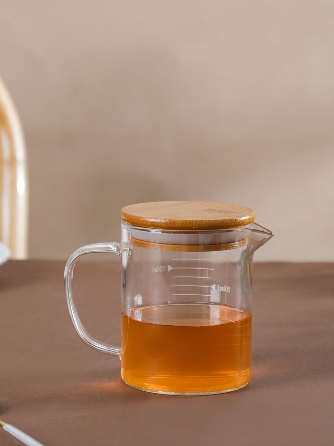 

Nestasia Transparent & Brown Printed Glass Transparent Mug-350ml