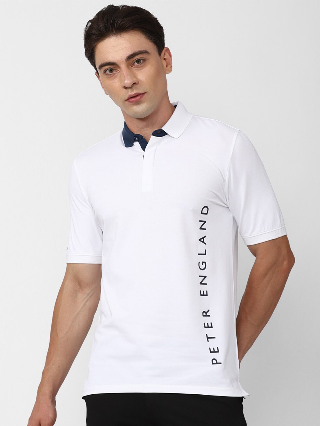 

Peter England Casuals Typography Printed Polo Collar Slim Fit T-shirt, White