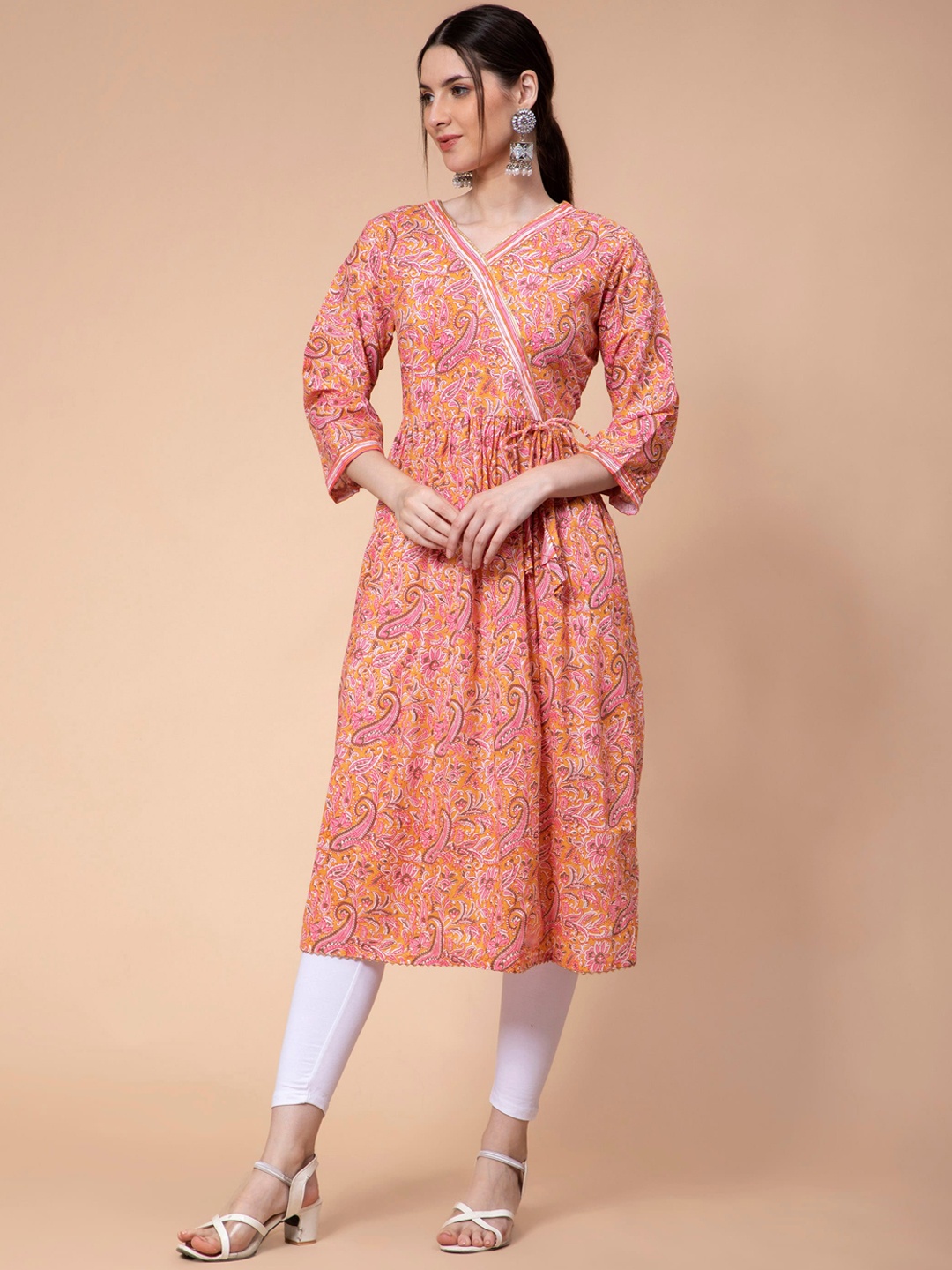 

Fabclub Women Peach-Coloured Ethnic Motifs Printed Flared Sleeves Thread Work Kurta