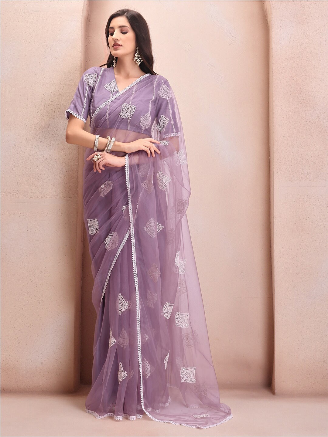 

Inddus Mauve Ethnic Motifs Embroidered Net Saree