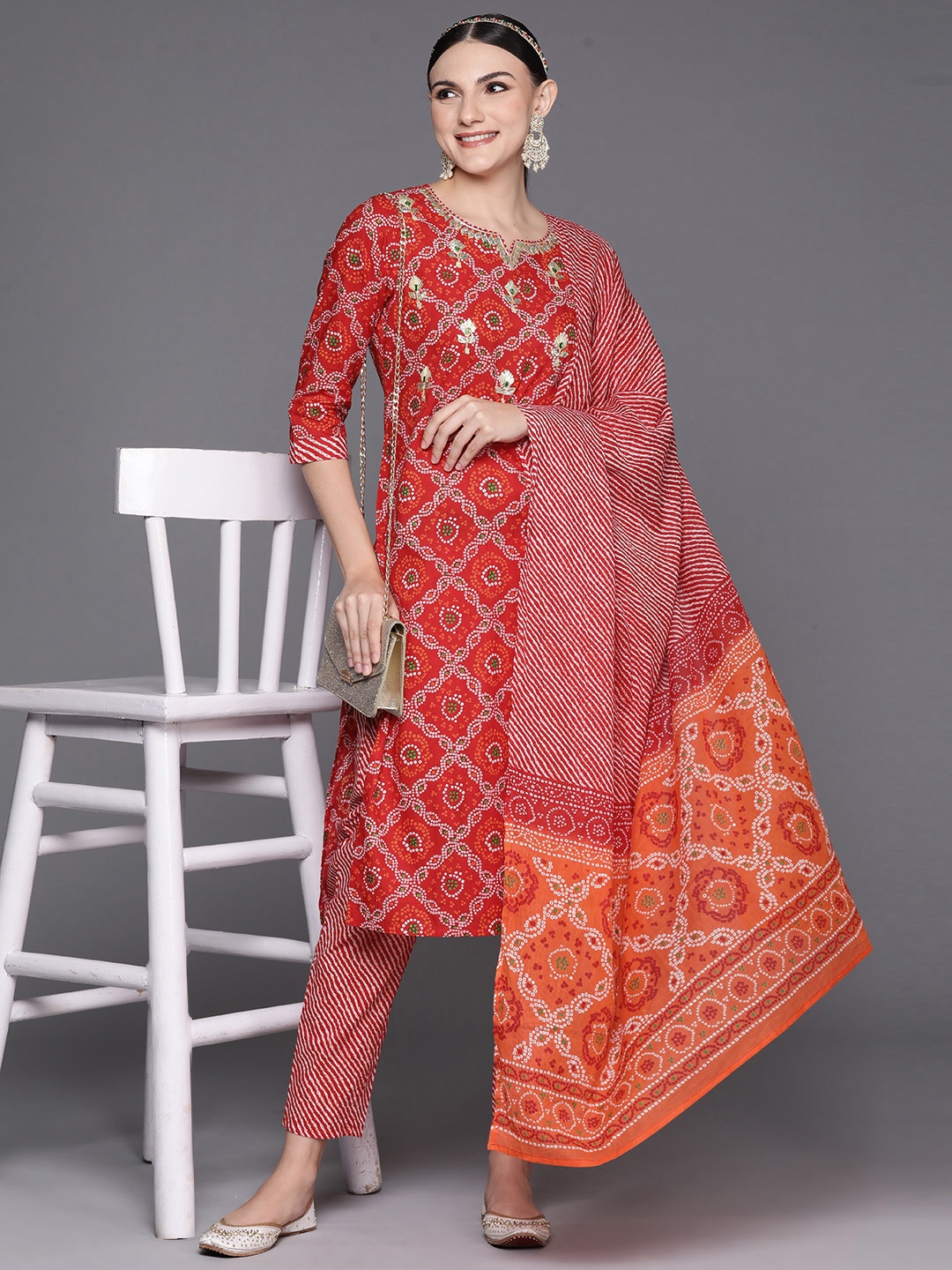 

Indo Era Women Red Bandhani Printed Regular Gotta Patti Pure Cotton Kurta with Trousers & With Dupatta