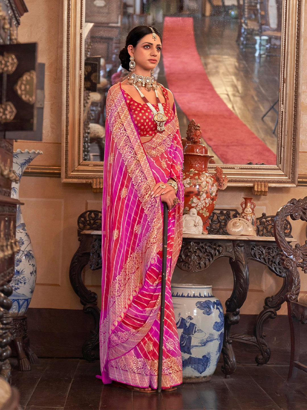 

Mitera Red & Pink Leheriya Embroidered Georgette Saree