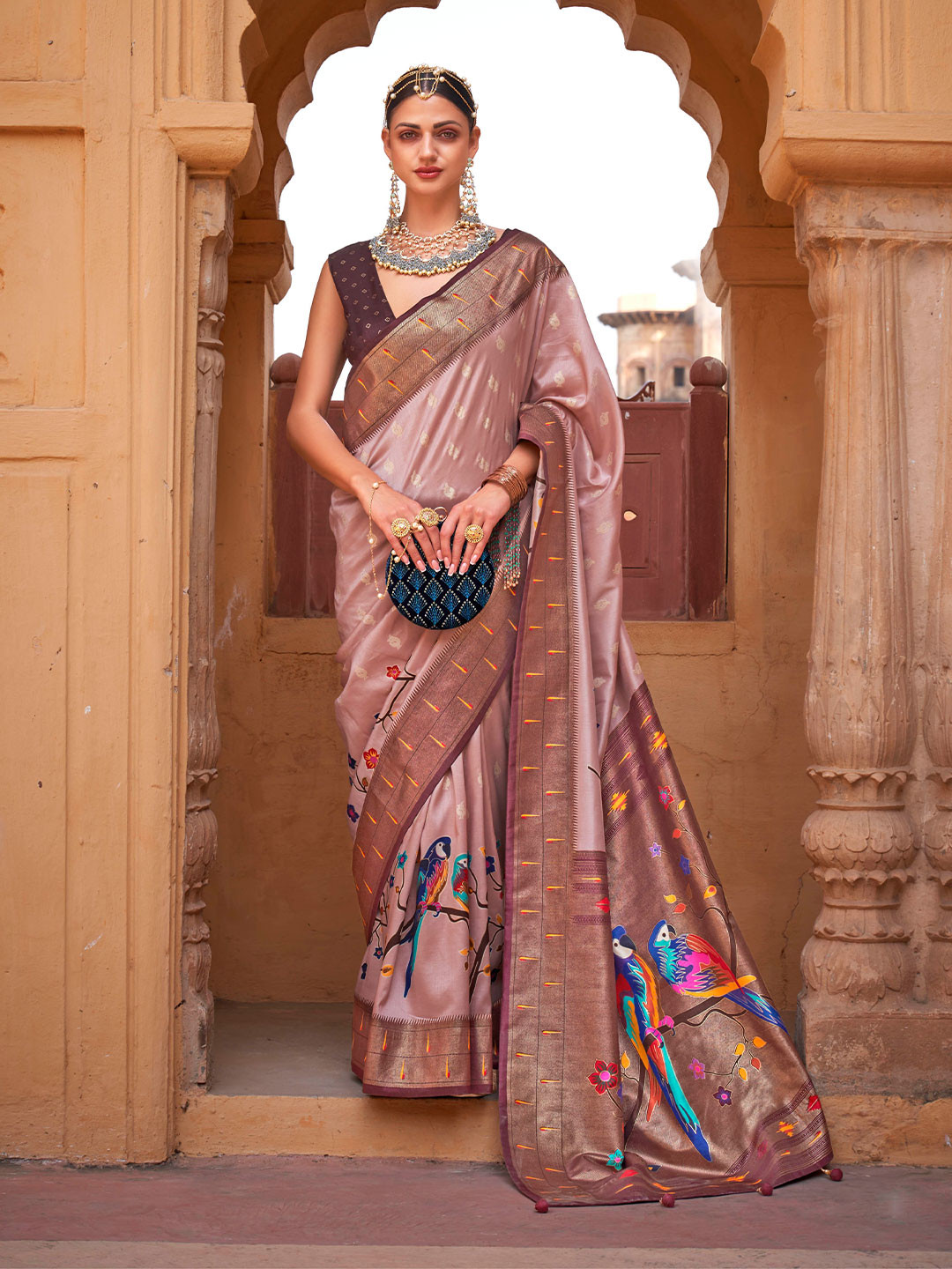 

Mitera Mauve & Blue Ethnic Motif Woven Design Zari Saree