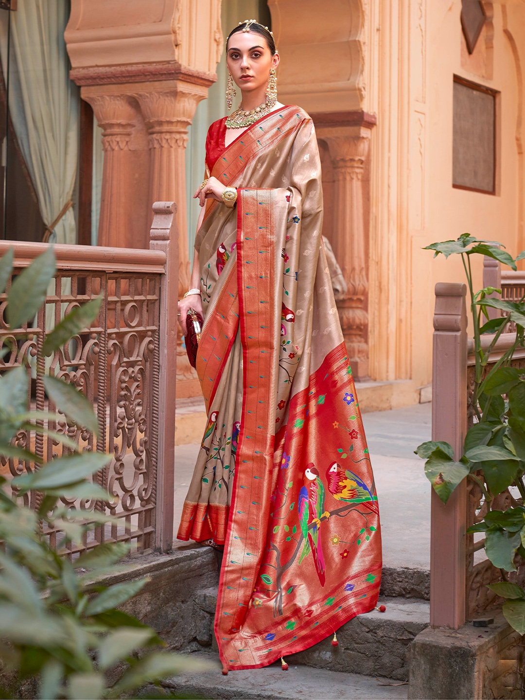 

Mitera Brown & Red Ethnic Motif Woven Design Zari Saree