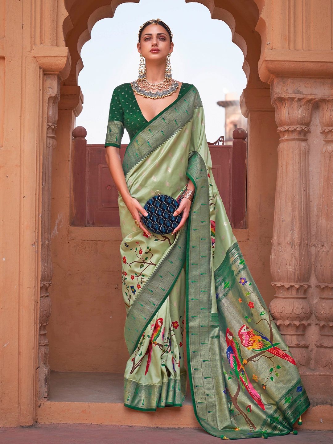 

Mitera Green & Red Ethnic Motifs Woven Design Zari Poly Silk Saree