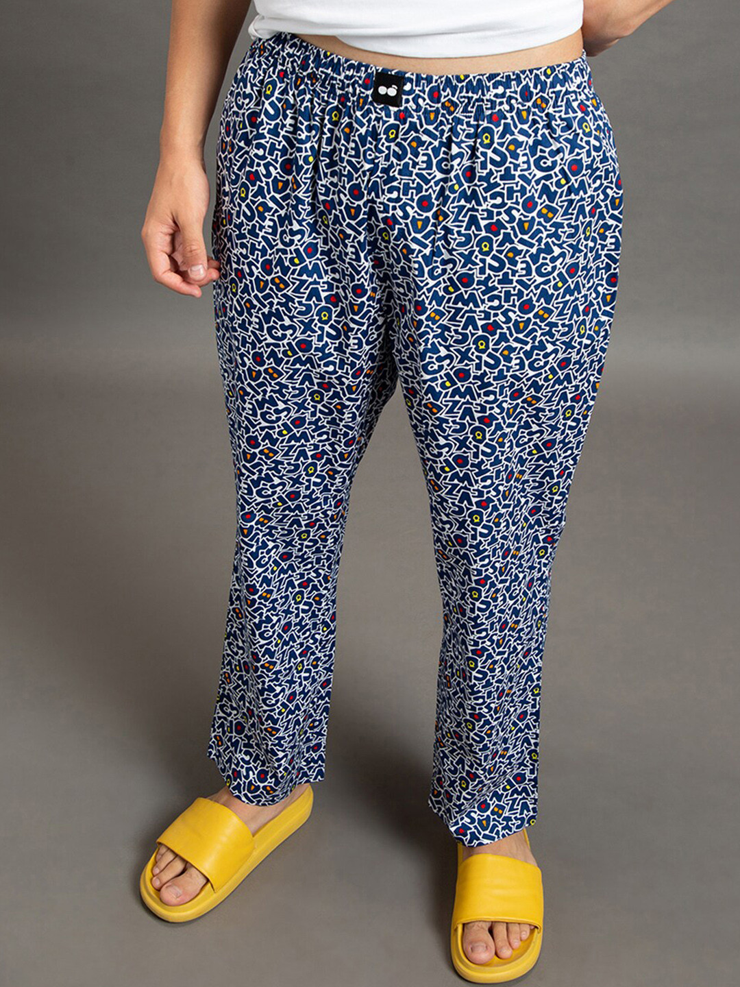 

Bewakoof Men All Over Alphabets Printed Lounge Pants, Blue