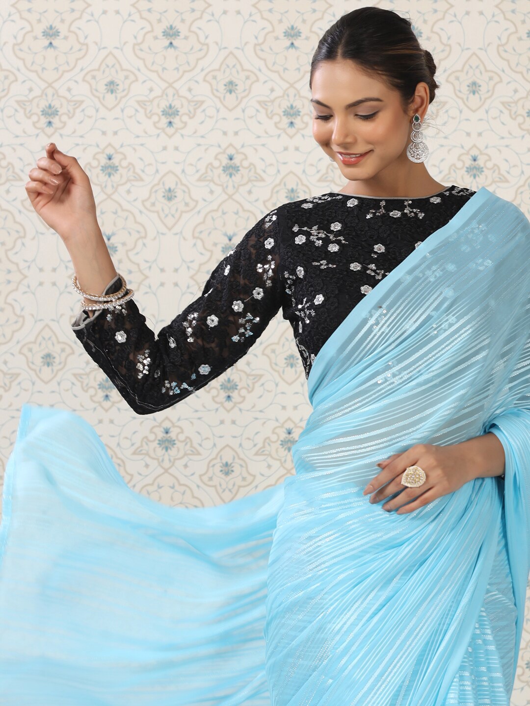 

Ode by House of Pataudi Blue Striped Sequinned Satin Saree