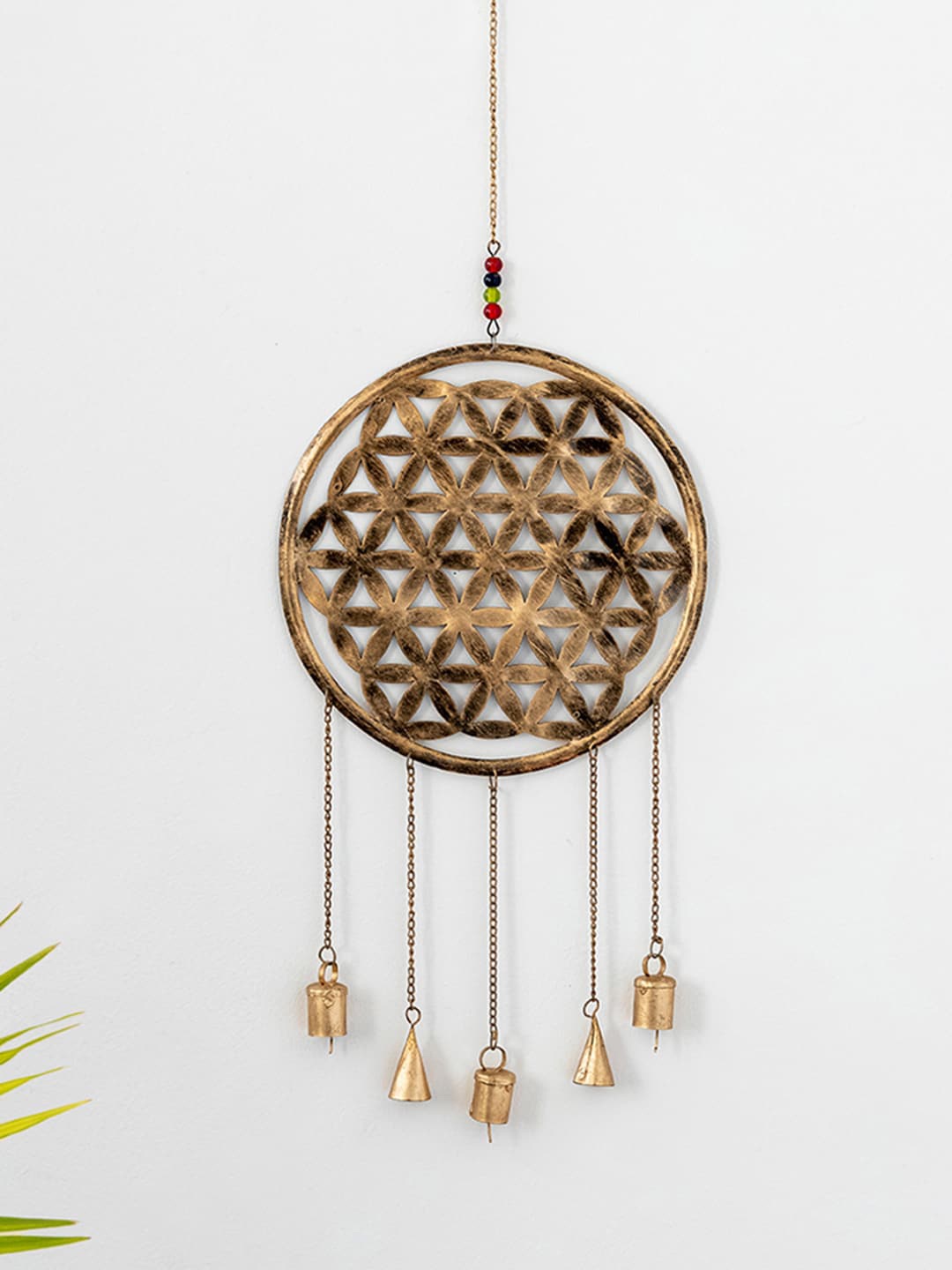 

ExclusiveLane Gold Toned Textured Wheel Kutch Windchime