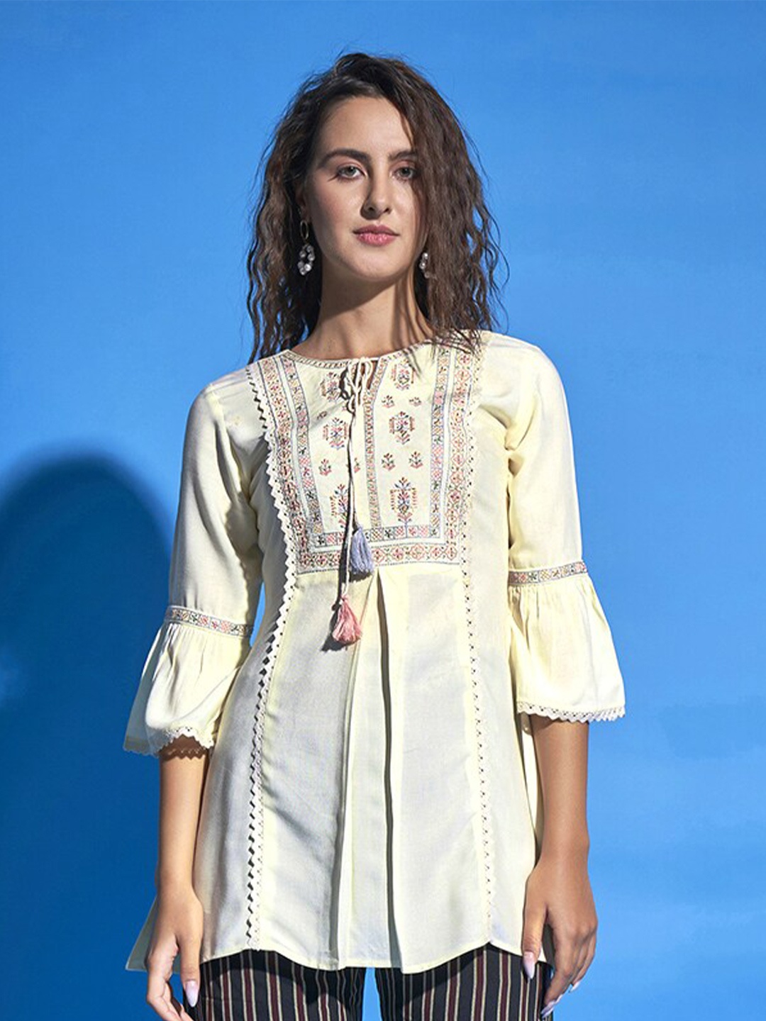 

Sangria Off White Floral Embroidered Tie-Up Neck Bell Sleeves Top