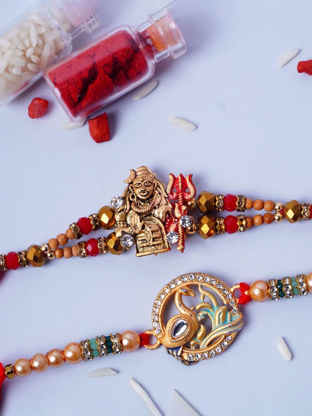 

Urmika Set Of 2 Shiva Meenakari Rakhi, Red