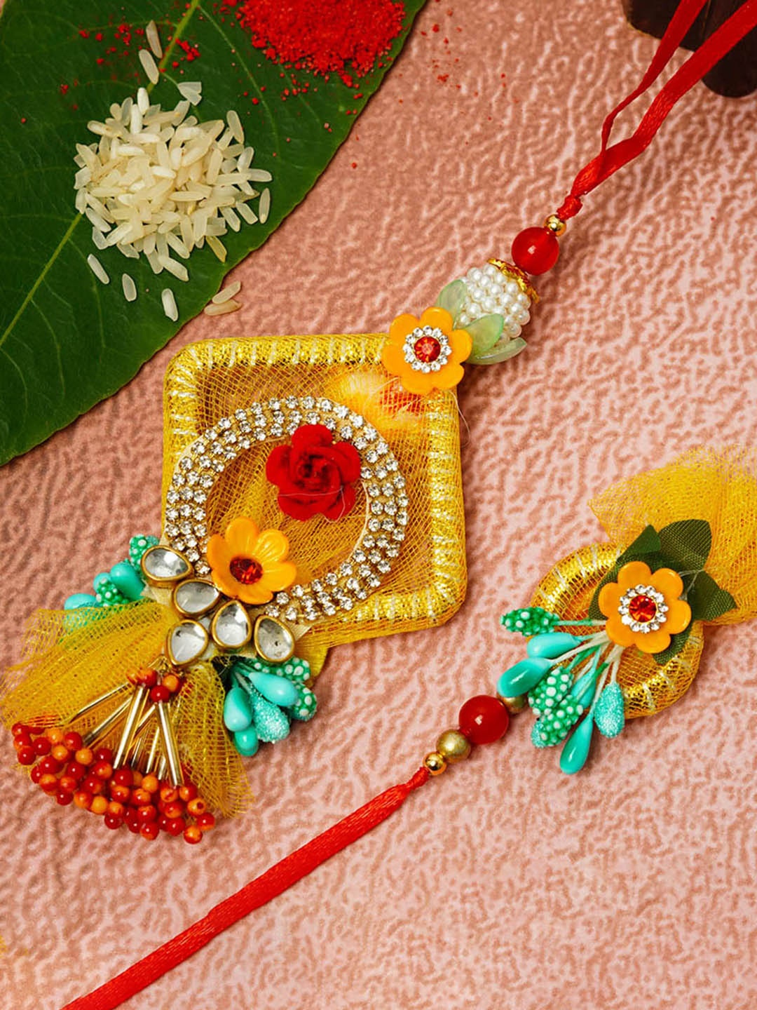 

Urmika Set Of 2 Stone Studded Net Gotta Lumba & Rakhi, Yellow
