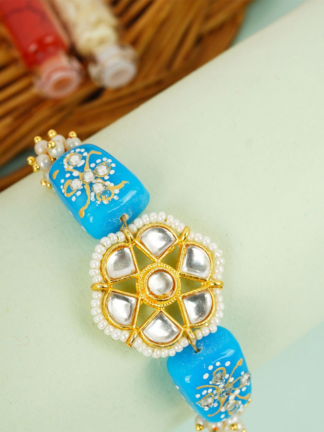 

Urmika Kundan Flower Rakhi, Blue