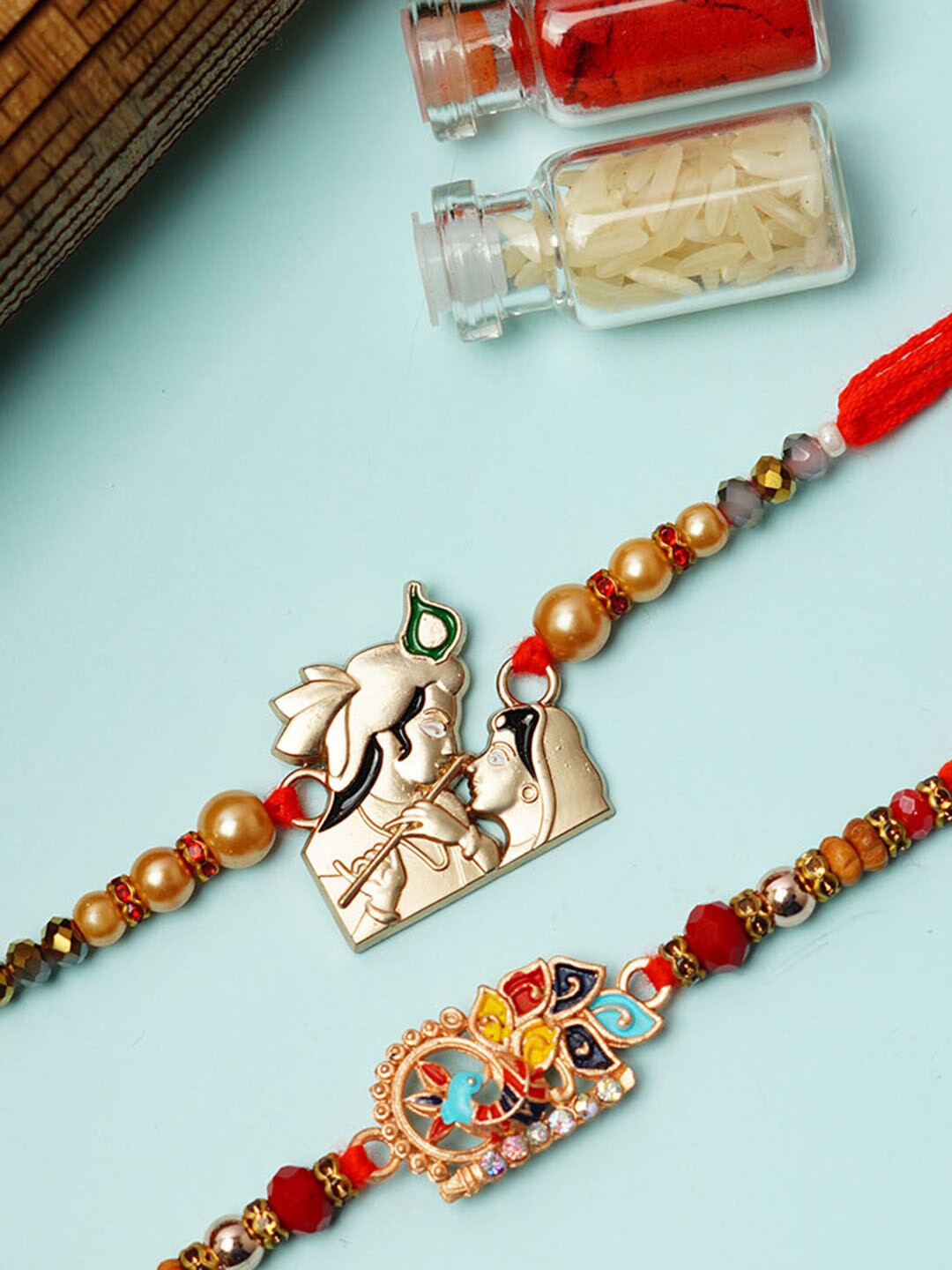 

Urmika Set Of 2 Krishna & Peacock Thread Rakhi, Red