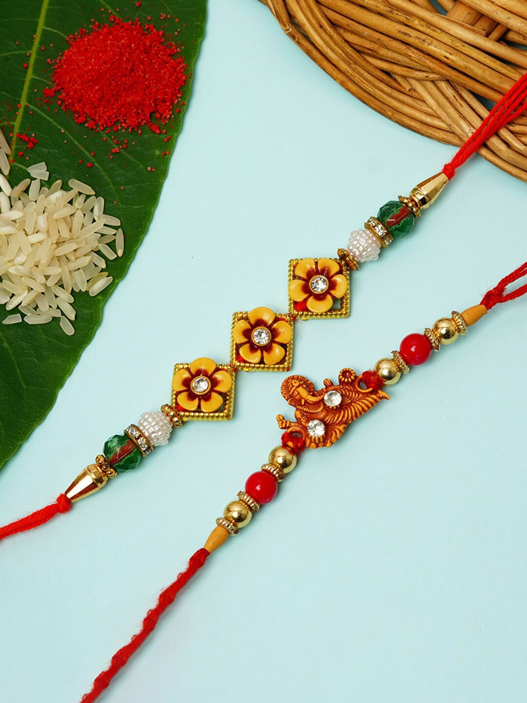

Urmika Set Of 2 Shri Ganesh & Flower Meenakari Rakhi, Yellow