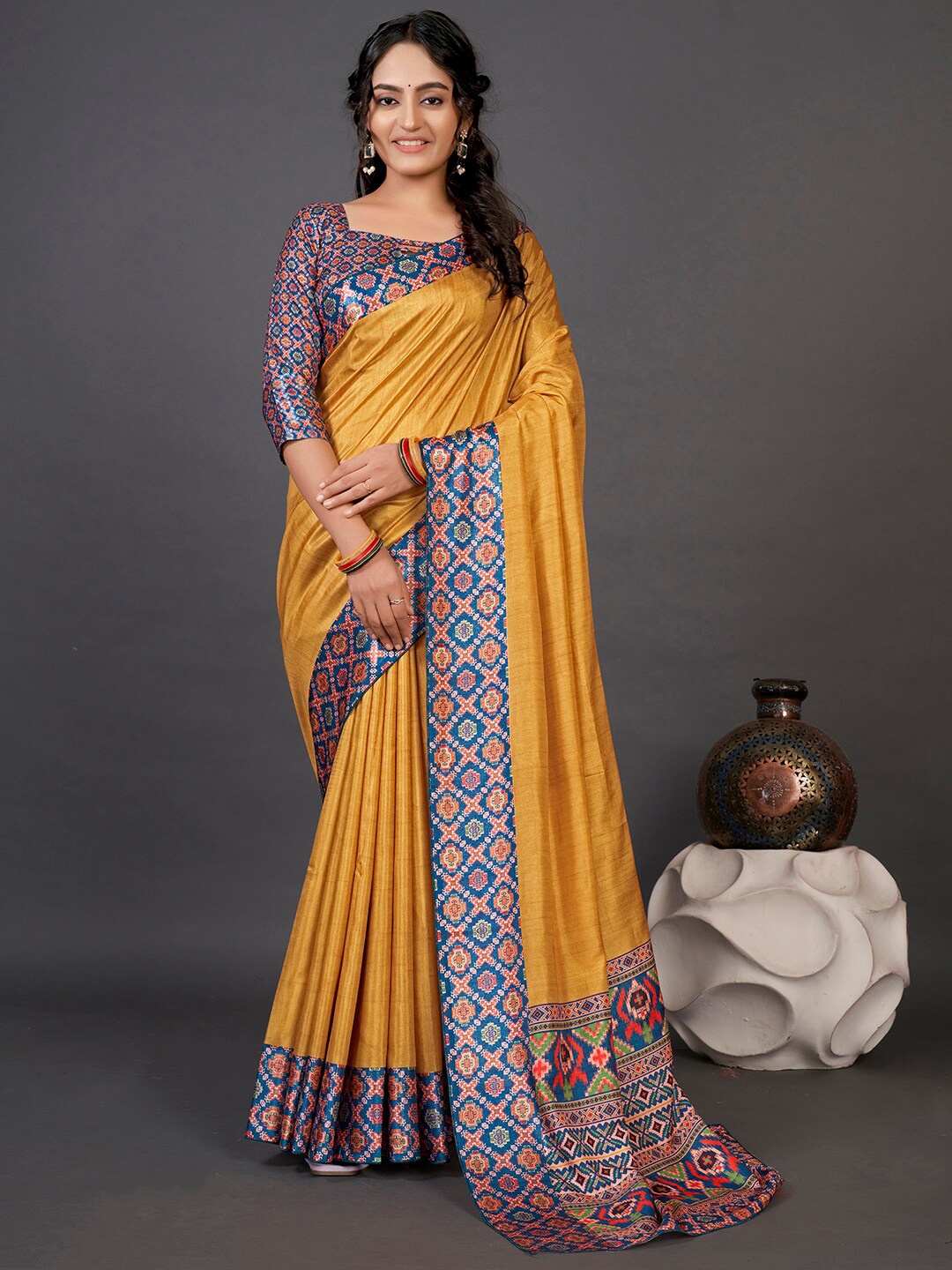 

Mitera Yellow & Blue Printed Border Patola Saree