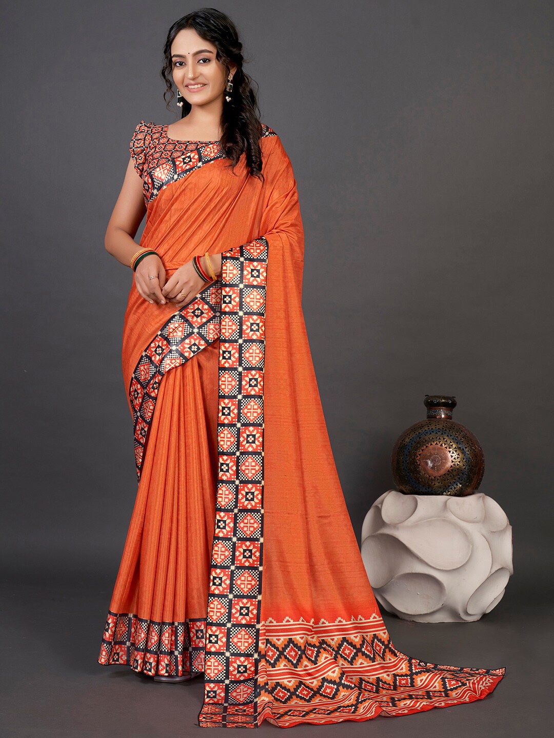 

Mitera Orange & Black Ethnic Motifs Printed Patola Saree