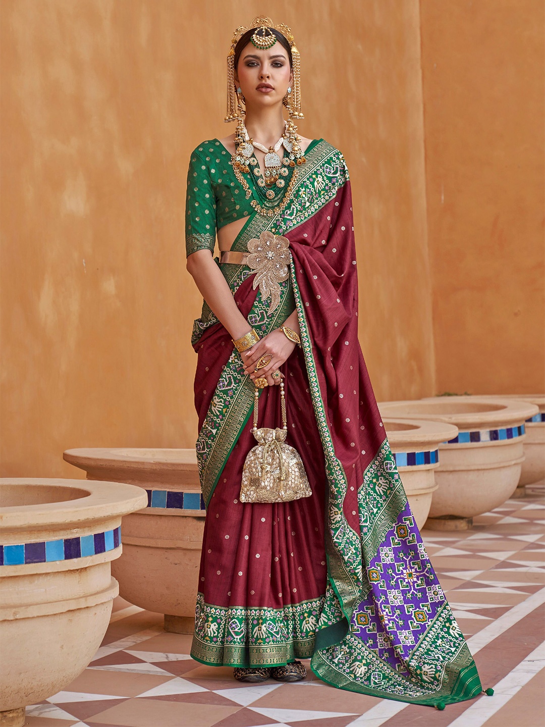 

Mitera Maroon & Green Ethnic Motifs Woven Design Zari Saree