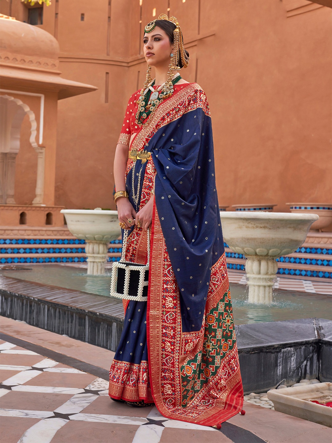 

Mitera Navy Blue & Red Ethnic Motifs Woven Design Zari Saree