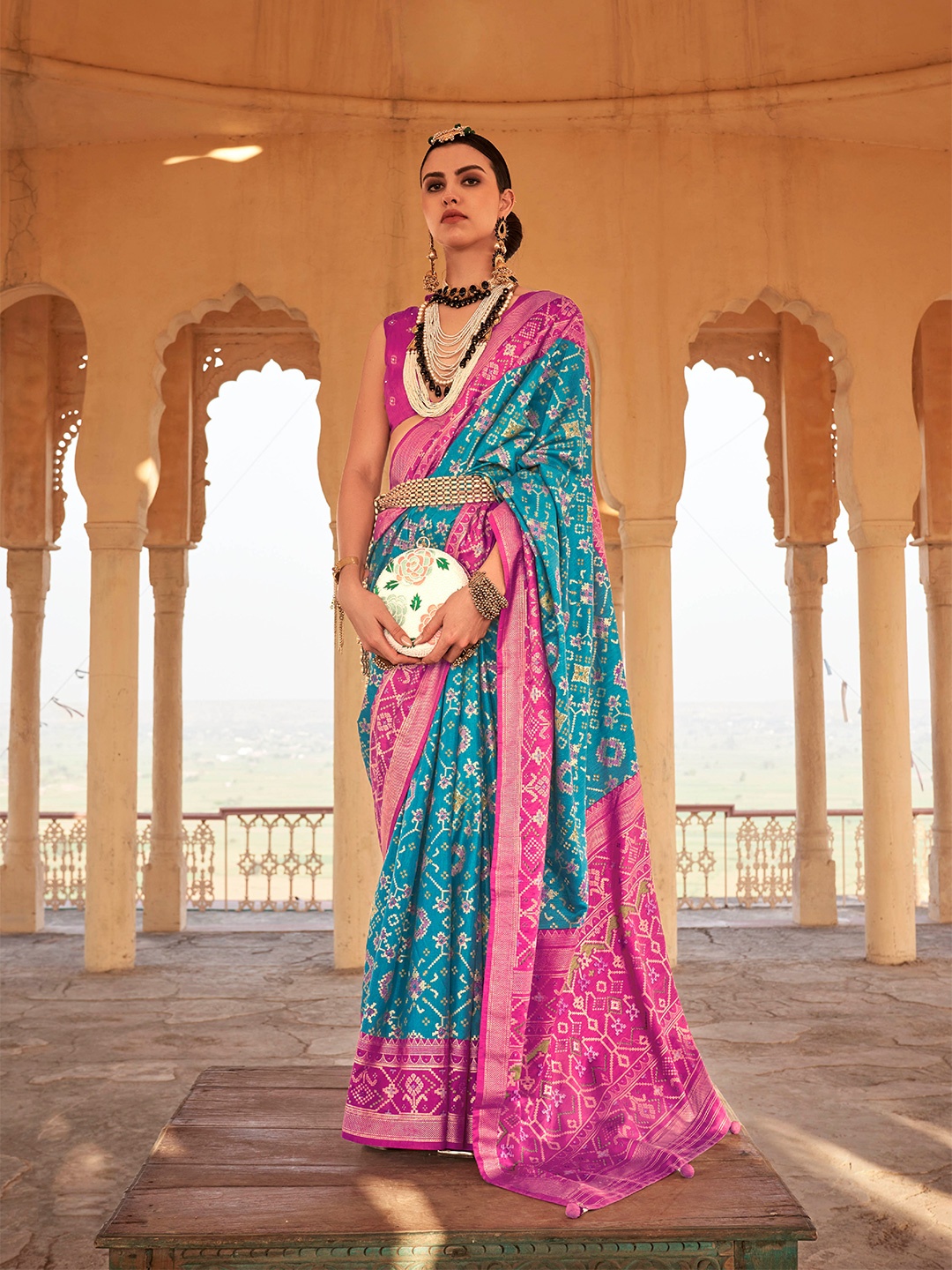 

Mitera Blue & Pink Ethnic Motifs Woven Design Saree