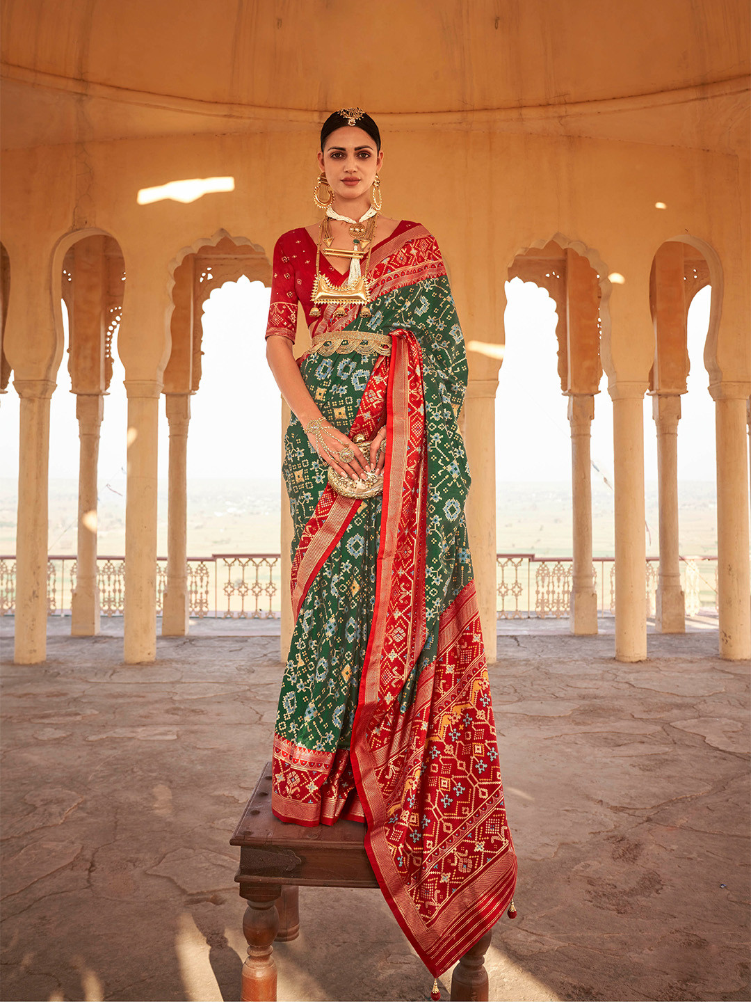 

Mitera Green & Red Ethnic Motifs Woven Design Saree