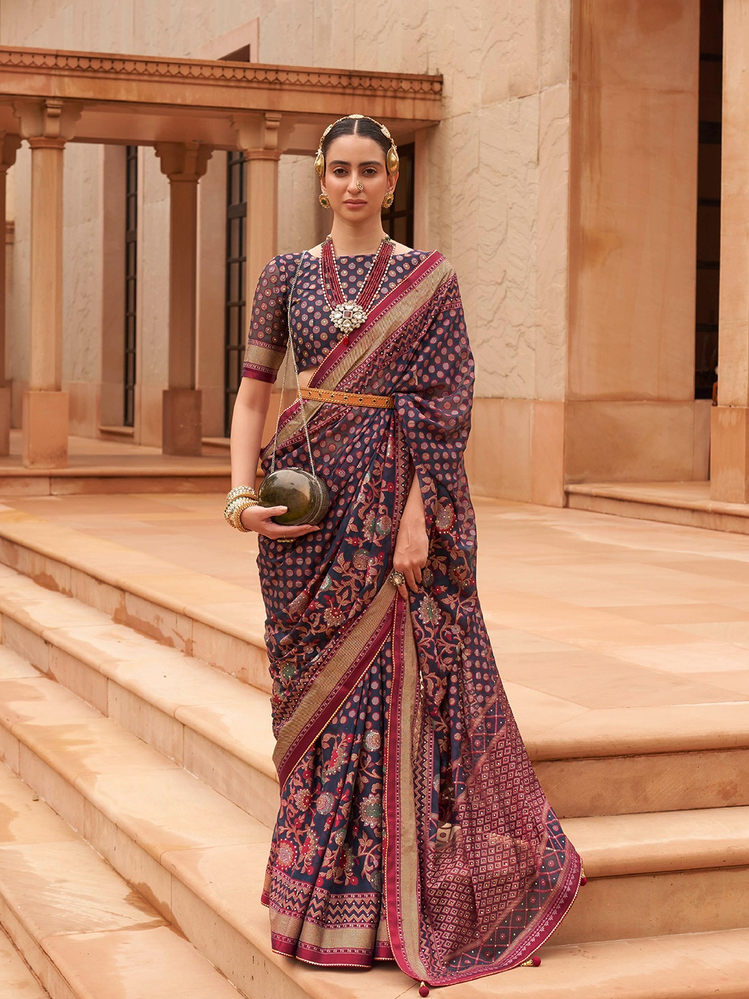

Mitera Navy Blue & Red Woven Design Zari Brasso Saree