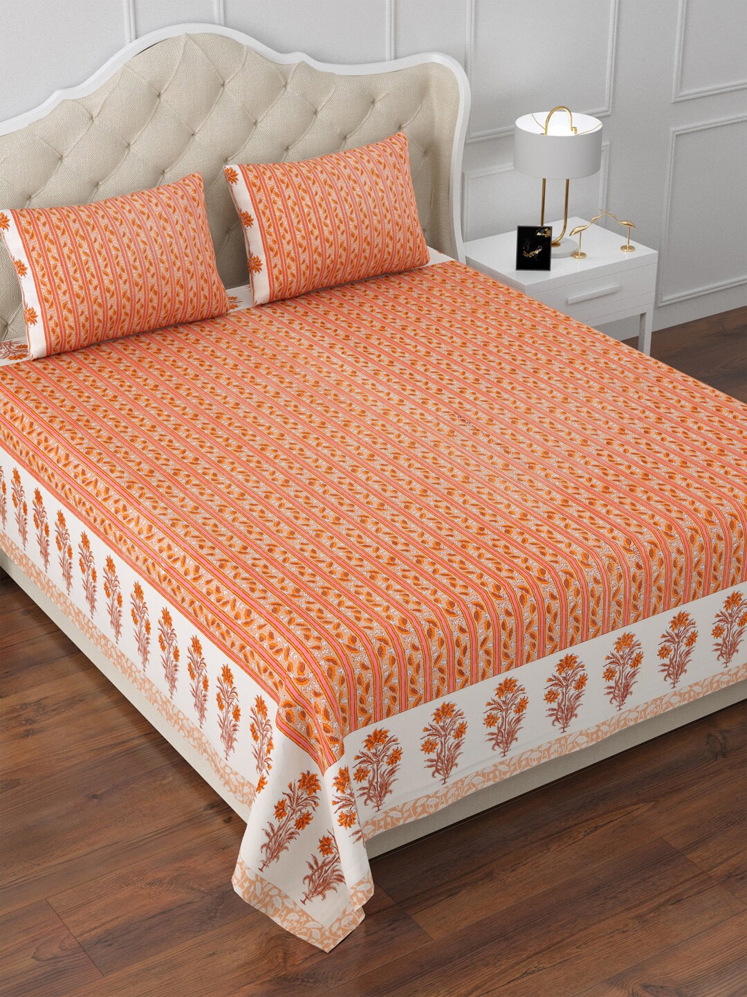 

Aapno Rajasthan White & Orange Floral 120 TC Cotton King Bedsheet & 2 Pillow Covers