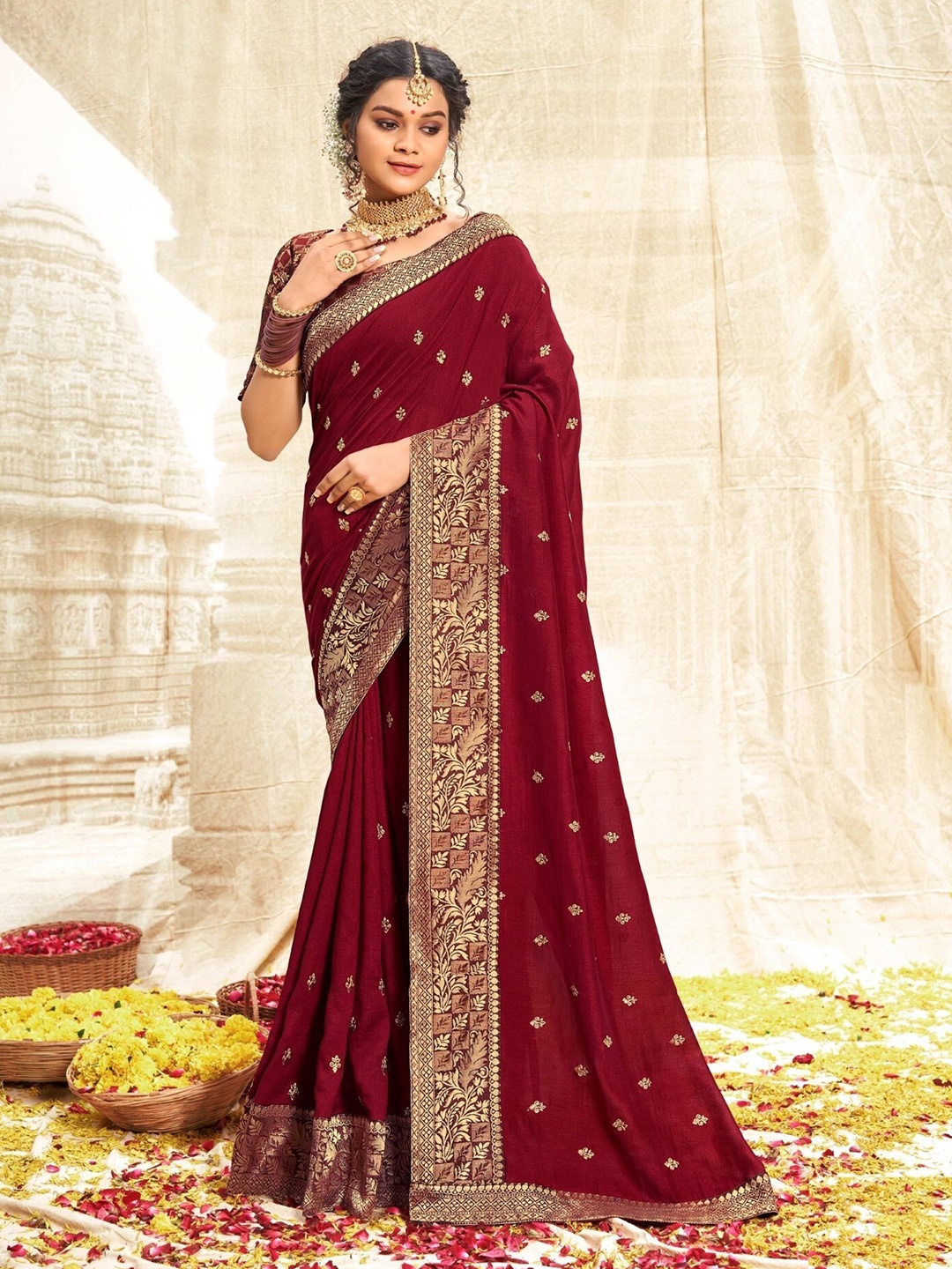 

Mitera Maroon & Gold-Toned Ethnic Motifs Zari Art Silk Saree