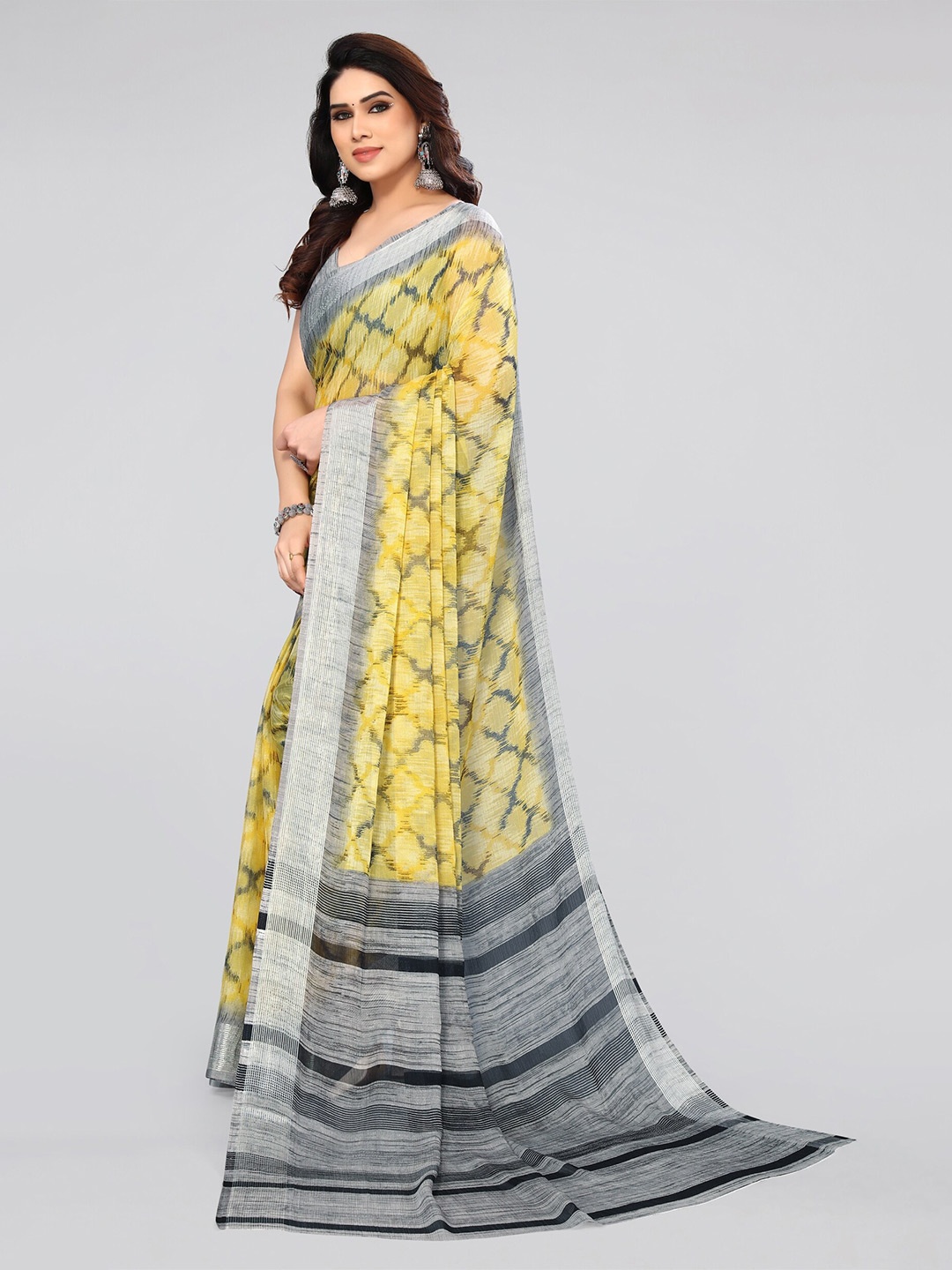 

MIRCHI FASHION Yellow & Silver-Toned Ikat Printed Zari Saree