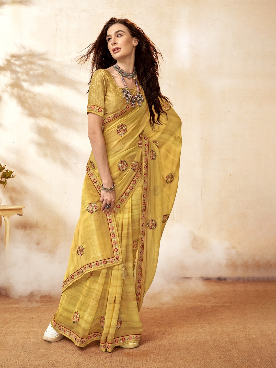 

Triveni Embroidered Pure Georgette Saree, Yellow