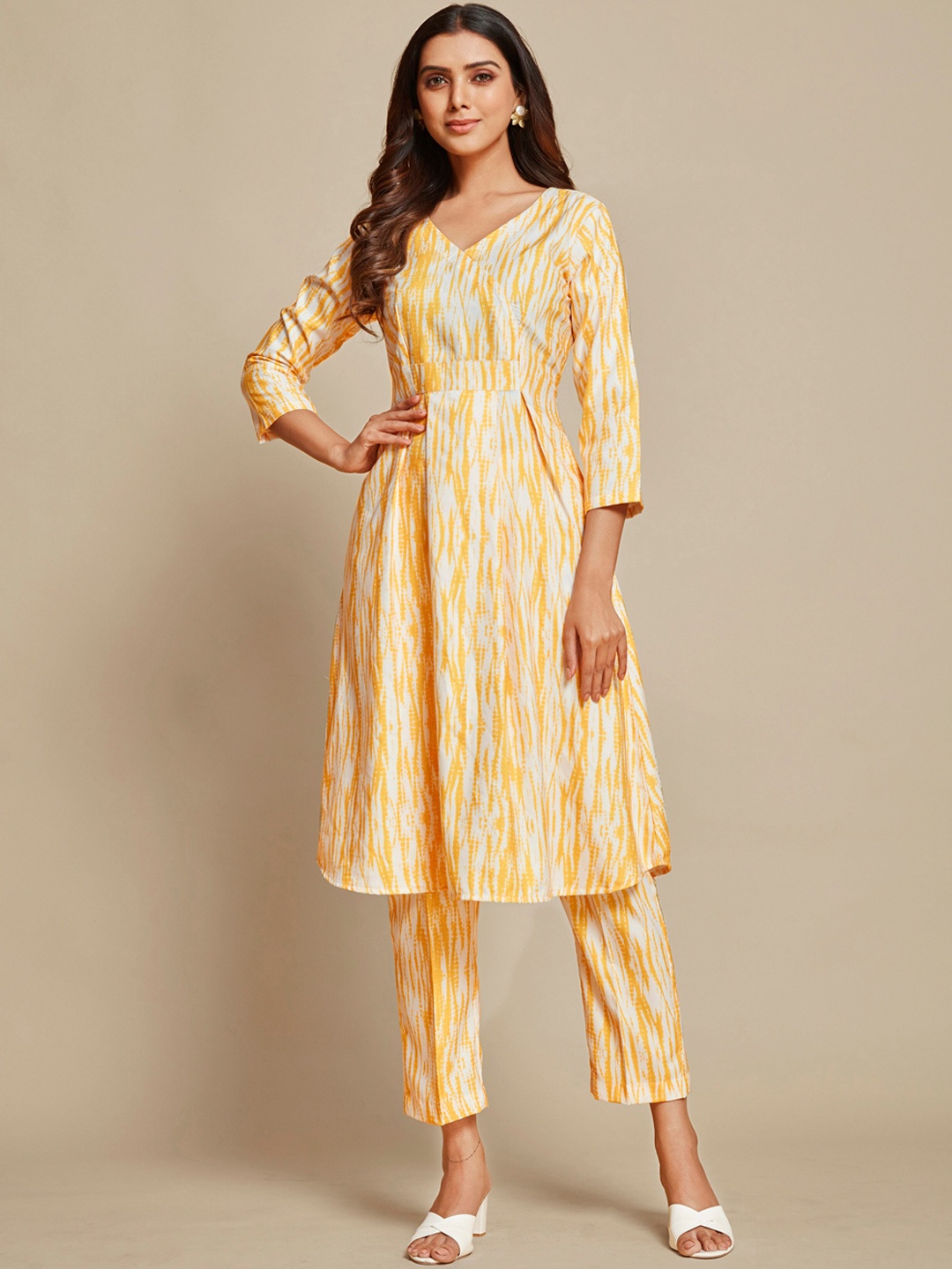 

Sangria Yellow Abstract Printed A-Line Kurta & Trouser, White