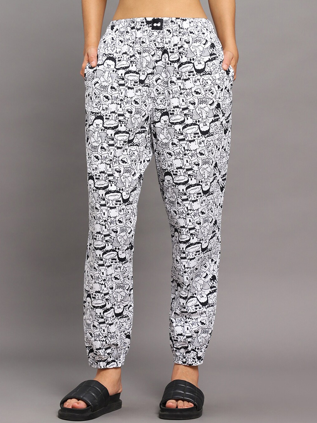 

Bewakoof Women All Over Cartoon Printed Mid-Rise Lounge Pants, White