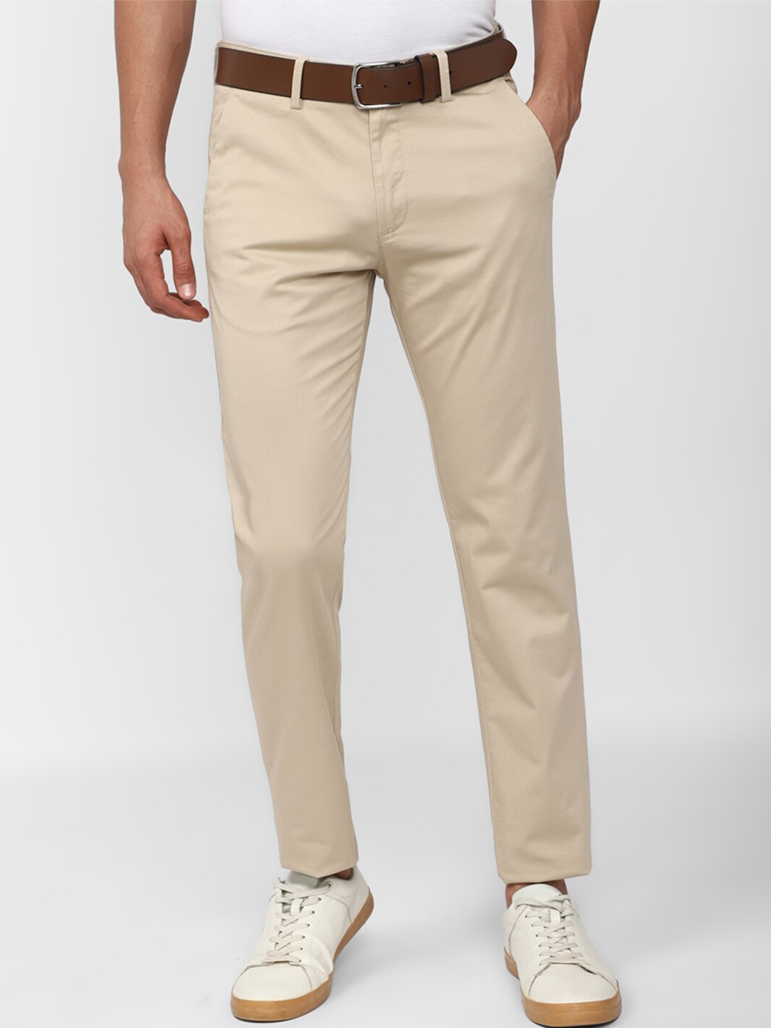 

Peter England Casuals Men Mid Rise Cotton Trousers, Beige