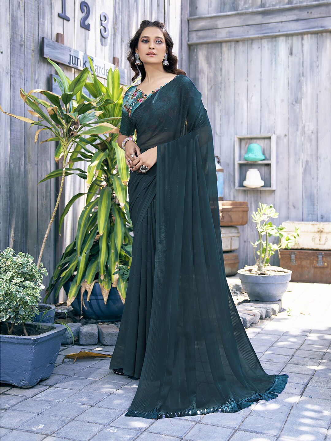 

Mitera Teal Blue Striped Poly Georgette Saree