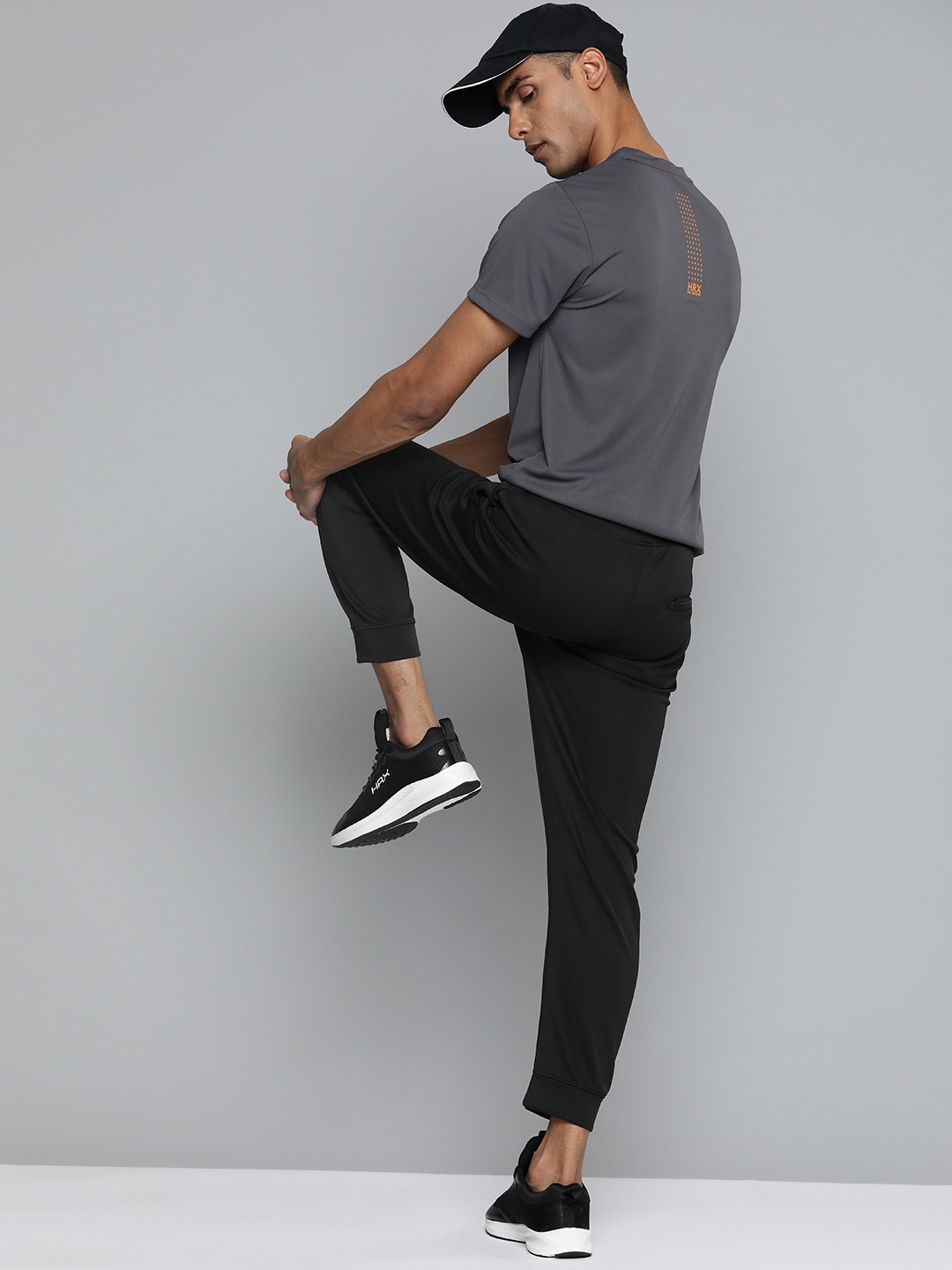 

HRX by Hrithik Roshan Solid Rapid-Dry Minimal Printed Training T-shirt, Charcoal