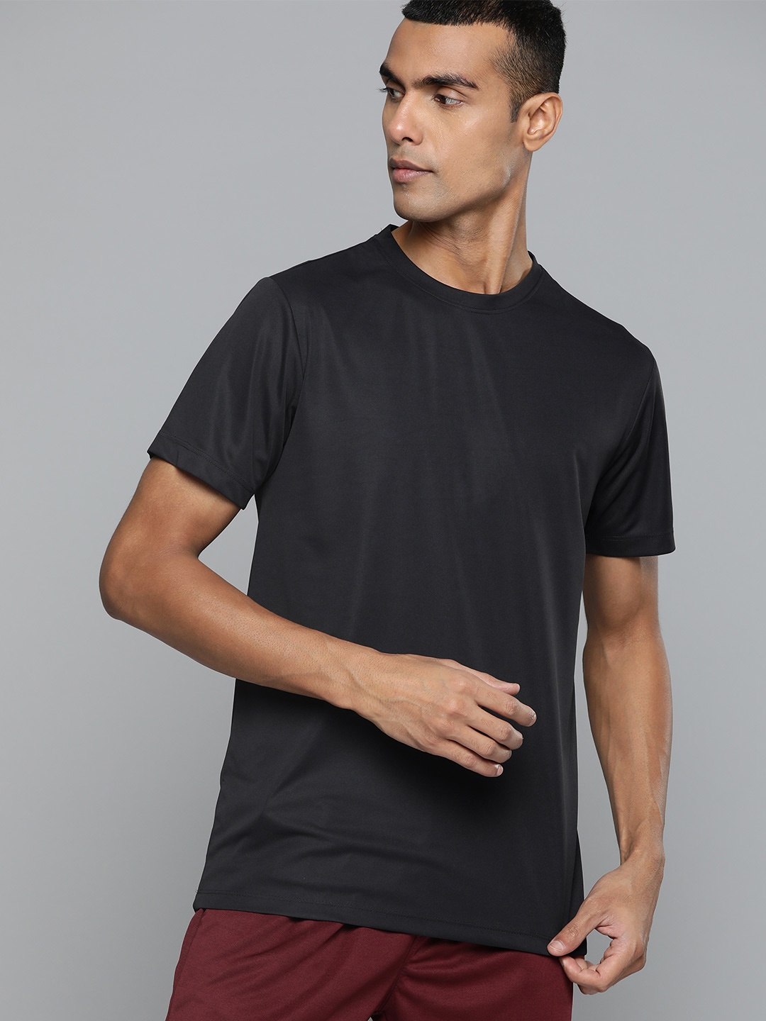 

HRX by Hrithik Roshan Solid Rapid-Dry Minimal Printed Training T-shirt, Black