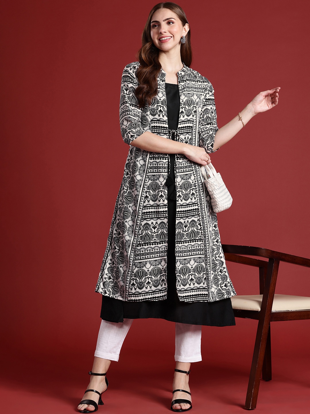 

Anouk Solid Sleeveless Kurta Comes With A Printed Tie-up Jacket, Black