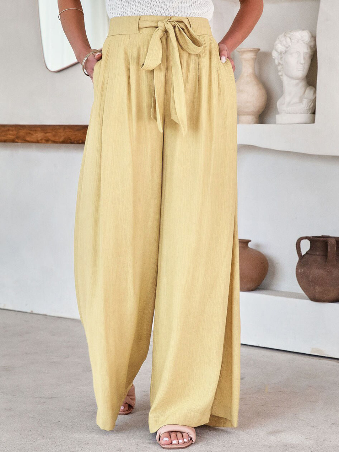 

StyleCast Women Beige Mid-Rise Flared Fit Trousers