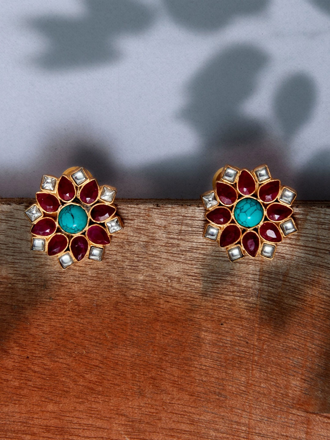 

Neeta Boochra Gold-Plated Contemporary Studs Earrings