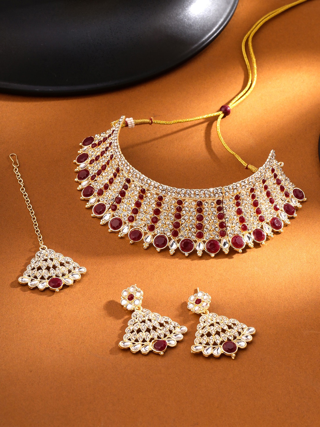 

Yellow Chimes Gold Plated Kundan Studded Necklace Set With Maangtikka, Maroon