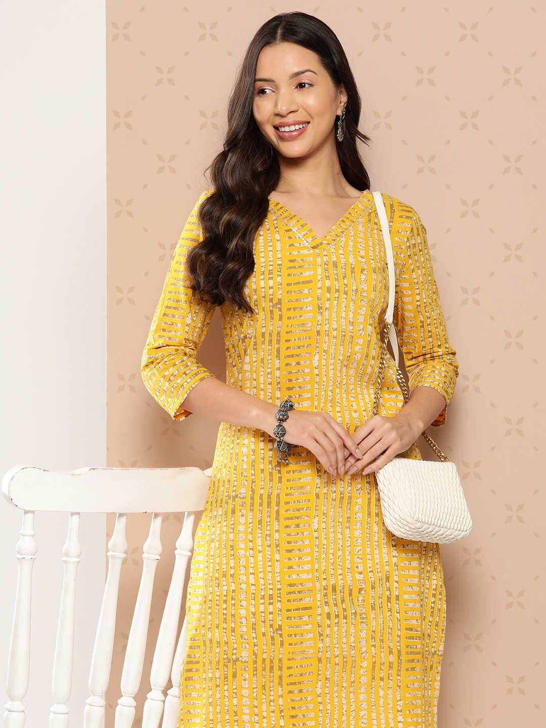 

Varanga Women Striped Embellished Gotta Patti Kurta, Yellow