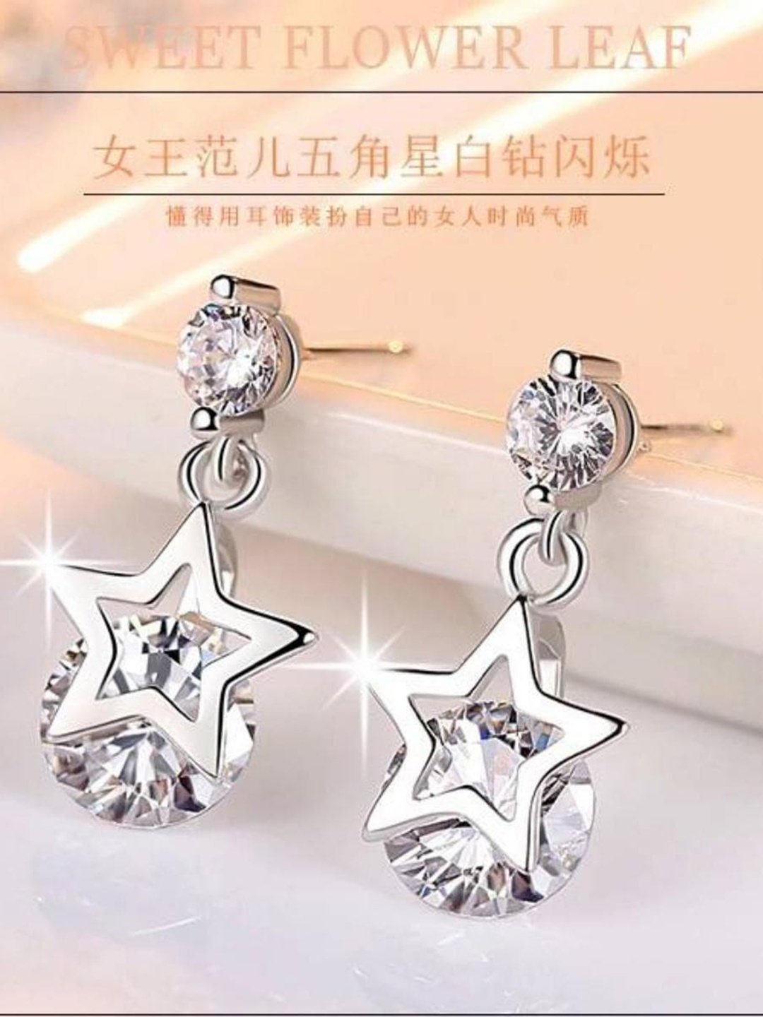 

MYKI Silver-Toned Star Shaped Drop Earrings