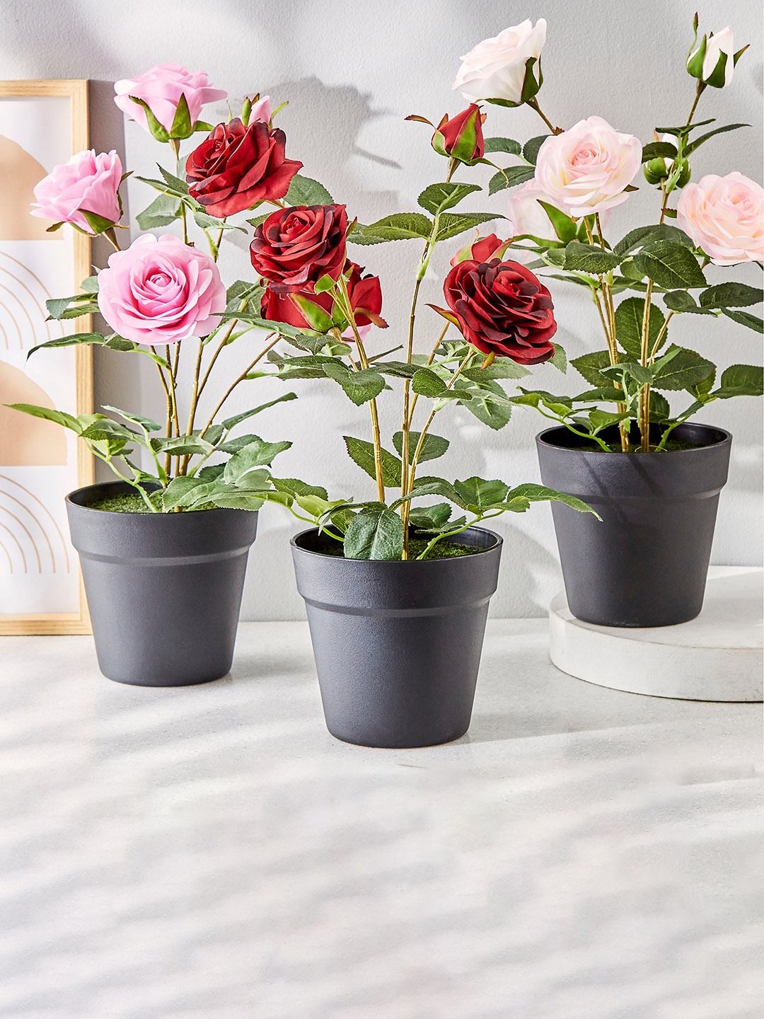 

Home Centre Pink & Green Artificial Rose Potted Plant