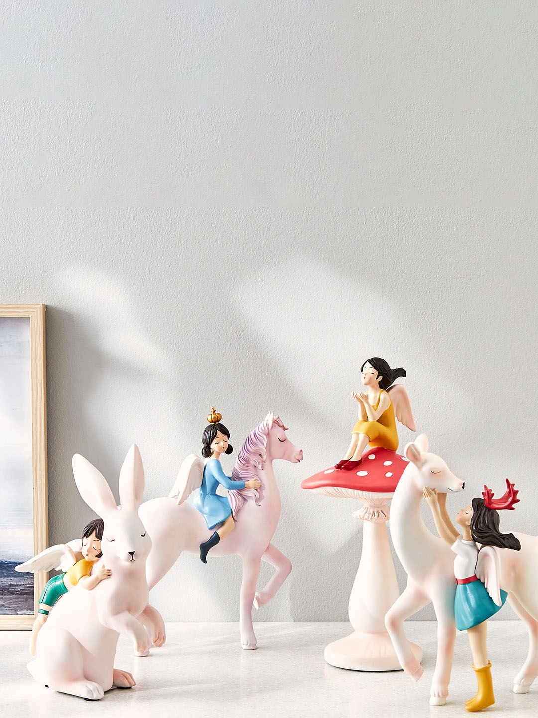 

Home Centre White & Yellow Girl On Rabbit Figurine Showpiece