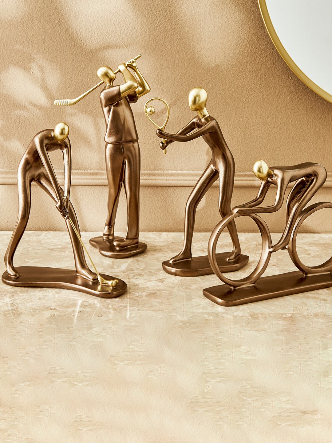 

Home Centre Gold-Toned Cycling Figurine Showpiece